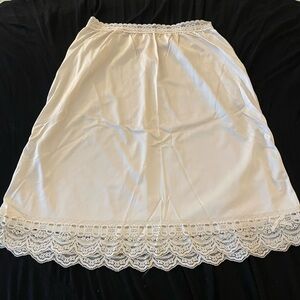 This feminine, cream color, half slip by OLGA